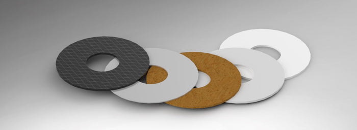 Comparison layout of common fishing reel drag washer materials, showing traditional and modern options side by side, including cork, felt, fiber, synthetic, carbon-fiber, and stainless drag components.