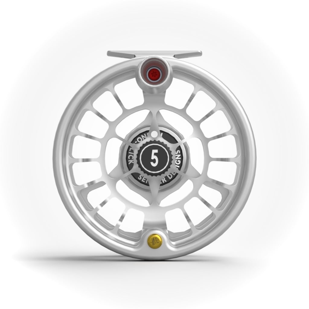 Handle-side view of a Seigler size 5 fly reel showing the spool, handle, counterweight, and hubcap